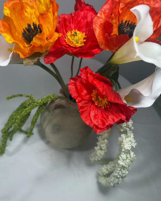 Close-up of The Montauk Large — real-touch red poppy blooms and white calla lilies with trailing amaranthus detail. Silk flowers by Deadass Flowers NYC.