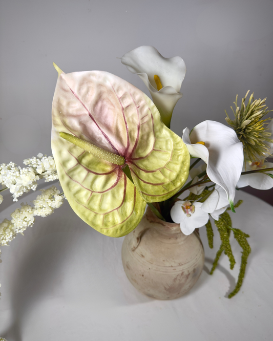 Close-up of real-touch anthurium and calla lily in The Sara J Large silk flower arrangement.