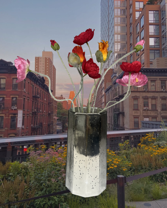 The Poppy silk arrangement styled in a clear glass vessel.