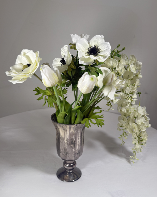 The Gramercy real-touch silk arrangement with trailing wisteria, dark anemones, and loose tulips. Made to order in NYC.