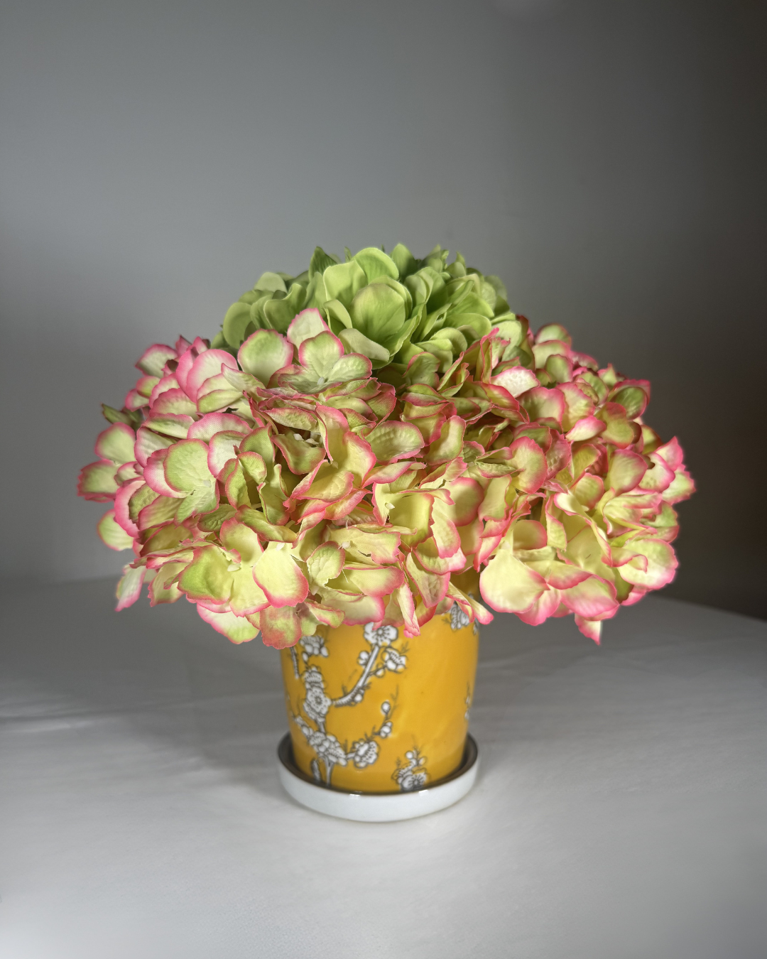 The Park silk flower arrangement — a soft, garden-gathered faux floral bouquet in a clear glass vase. 9 inches tall, the smallest in our collection. Hand-arranged in NYC by Deadass Flowers.