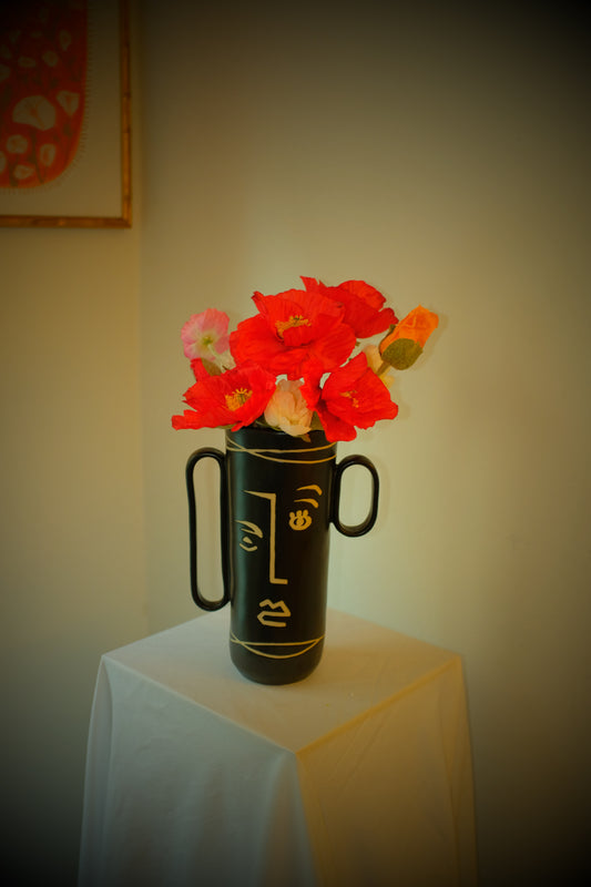Red Poppies — silk red poppies, white cosmos, and pink poppy bud in a tall black ceramic vintage vase with line-drawing detail. One of one, made in NYC.