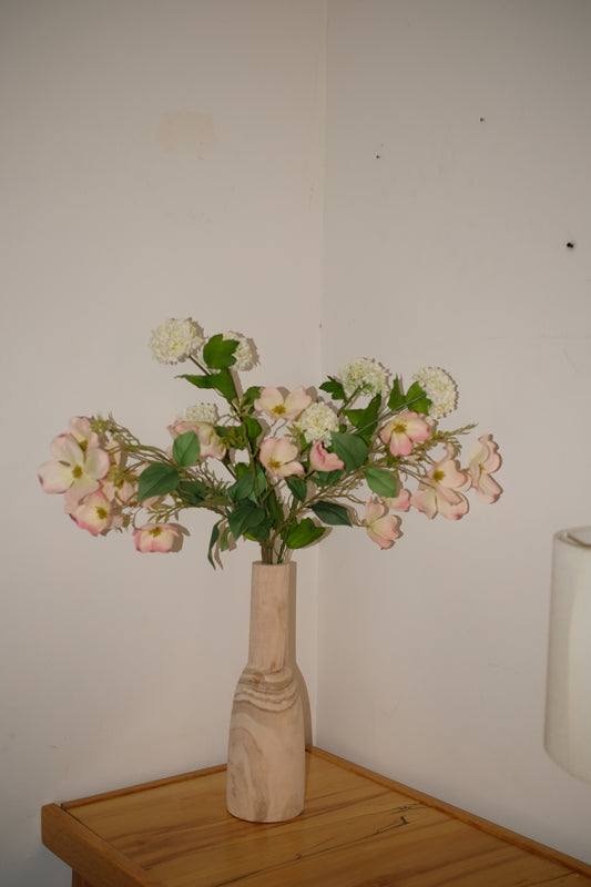 The Gracie — silk pink dogwood and white viburnum in a tall turned-wood vase. Made to order in NYC.