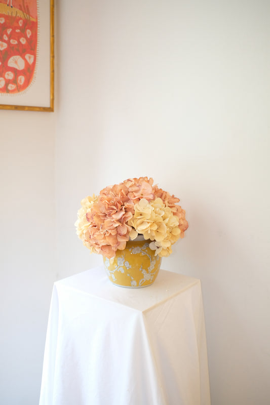 The York — cream and blush silk hydrangea arrangement in a vintage-inspired yellow chinoiserie vase. Handmade in Manhattan.