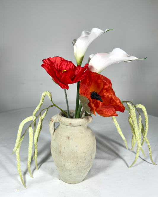 The Montauk Mini — compact real-touch silk red poppy and white calla lily arrangement with trailing amaranthus. Made to order in NYC.