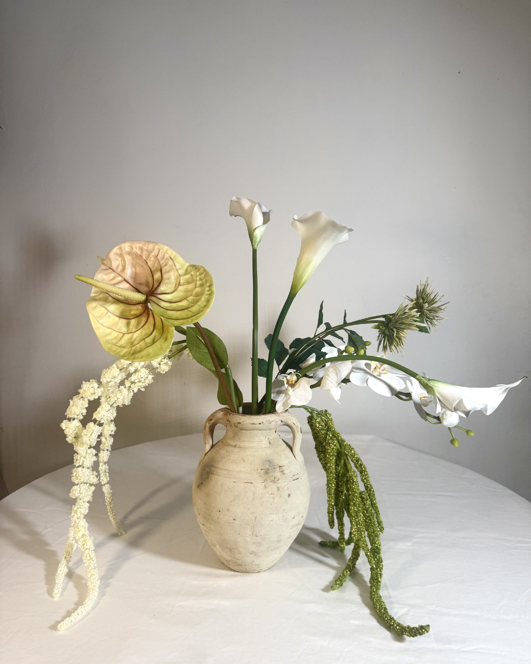 The Sara J Large — statement white silk flower arrangement with real-touch calla lilies, anthurium, and orchid in a ceramic vessel. Made to order in NYC.